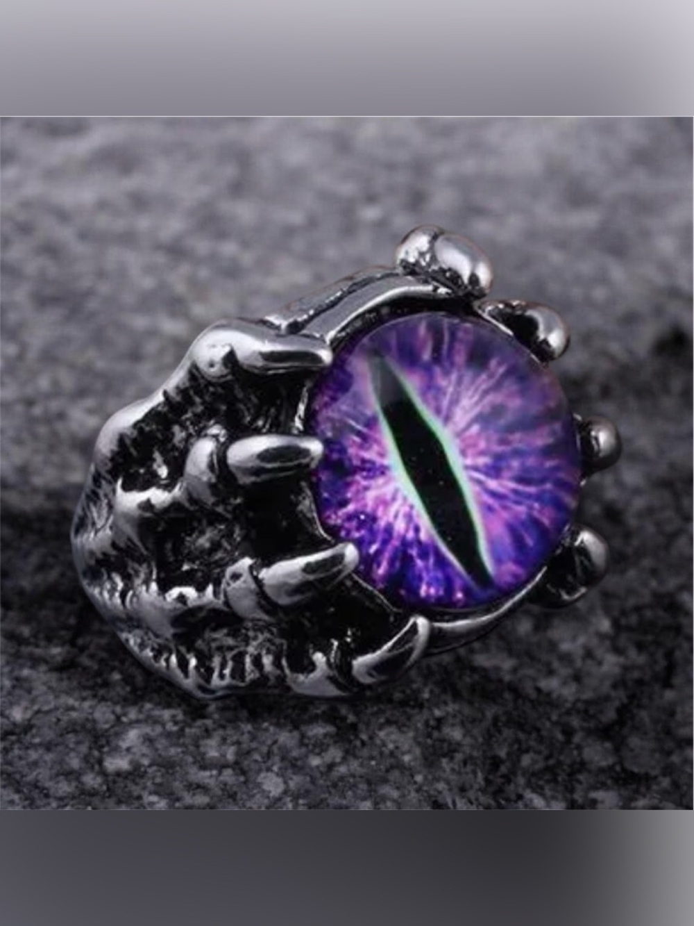 Claw Holding Purple Eye Ring